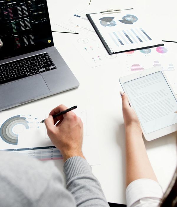 Young woman engineer holding digital tablet in modern industrial facility